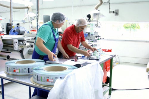 men working on packaging materials